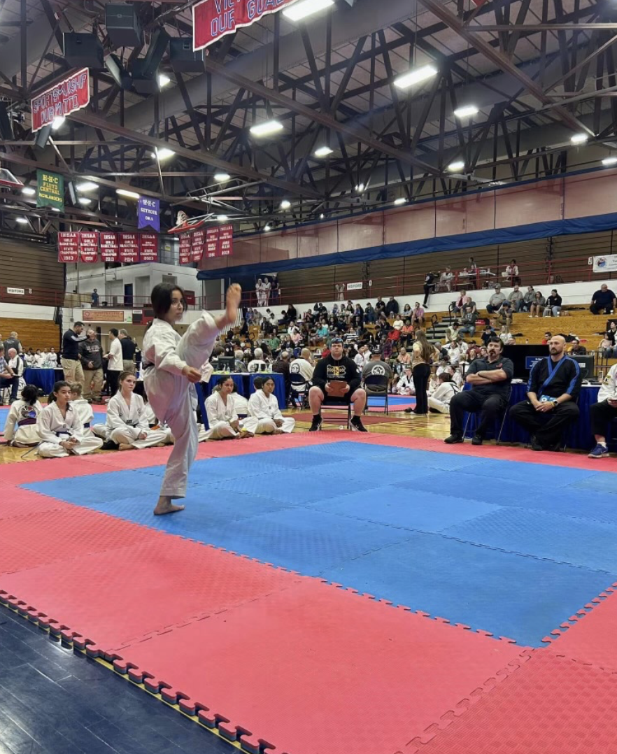 Rheina Avila competes at a Taekwondo tournament. 